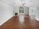 Bright living room with vaulted ceilings, large windows, and fireplace at 409 Kenley Ct, Mcdonough, GA 30253