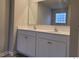 Bathroom vanity featuring double sinks, quartz countertop, and shaker style cabinets at 6615 Bluffview Dr, Douglasville, GA 30134