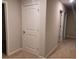 Hallway featuring neutral walls, carpet flooring, and white trim and doors at 6615 Bluffview Dr, Douglasville, GA 30134