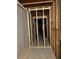 Unfinished basement featuring exposed wood frame, concrete floors and open ceiling at 6615 Bluffview Dr, Douglasville, GA 30134