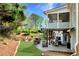 Expansive backyard offers a patio, grill, fire pit, and outdoor furniture for entertaining at 7430 Polo Hl, Cumming, GA 30040