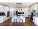 Open kitchen with a central island, stainless steel appliances, and a bar area with seating at 7430 Polo Hl, Cumming, GA 30040
