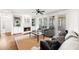 Cozy living room with a fireplace, built-in shelving, and comfortable seating at 7430 Polo Hl, Cumming, GA 30040