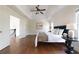 This spacious main bedroom features hardwood floors, a tray ceiling, and access to a walk-in closet at 7430 Polo Hl, Cumming, GA 30040
