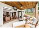 Inviting outdoor living space with a fire pit and indoor/outdoor bar and seating at 7430 Polo Hl, Cumming, GA 30040