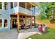 Enjoy the outdoors with a patio, seating, and grill setup beneath a screened porch at 7430 Polo Hl, Cumming, GA 30040