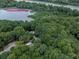 Aerial view of the wooded property showcasing the estate's privacy and scenic surroundings near Chattahoochee River at 120 Huntcliff Pt, Atlanta, GA 30350