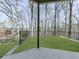 Expansive outdoor space with a black metal fence bordering the property at 120 Huntcliff Pt, Atlanta, GA 30350
