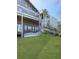 The backyard shows a well-manicured lawn and deck with multiple sliding glass doors at 120 Huntcliff Pt, Atlanta, GA 30350