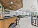 Finished basement features a wet bar, spacious seating area and stylish decor at 120 Huntcliff Pt, Atlanta, GA 30350