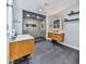 Modern bathroom featuring dual vanities, stylish mirrors, and a glass-enclosed shower at 120 Huntcliff Pt, Atlanta, GA 30350