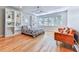 Bright bedroom with hardwood floors, built-in shelves, and large windows at 120 Huntcliff Pt, Atlanta, GA 30350