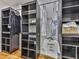 Walk-in closet with custom shelving and organization system at 120 Huntcliff Pt, Atlanta, GA 30350