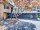 Exterior of a house with a stone facade and an attached garage, framed by trees and sky at 120 Huntcliff Pt, Atlanta, GA 30350