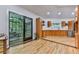 Modern kitchen with wood cabinets, stainless steel appliances, and an adjacent screened-in porch at 120 Huntcliff Pt, Atlanta, GA 30350