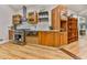Updated kitchen featuring wood cabinets, stainless steel appliances, and modern shelving at 120 Huntcliff Pt, Atlanta, GA 30350