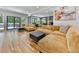 Inviting living room boasts large windows, hardwood floors, and comfortable seating; perfect for relaxing or entertaining guests at 120 Huntcliff Pt, Atlanta, GA 30350