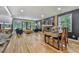 Bright and airy living room featuring hardwood floors, a fireplace, and sliding doors that lead to an outdoor patio at 120 Huntcliff Pt, Atlanta, GA 30350
