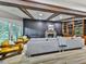 Bright living room with wood beams, large windows, and a cozy fireplace for relaxing at 120 Huntcliff Pt, Atlanta, GA 30350