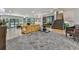 Spacious living room with stone flooring, comfortable seating, and access to outdoor balcony at 120 Huntcliff Pt, Atlanta, GA 30350