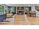 Open-concept living room with a cozy fireplace, modern accents, and plenty of natural light at 120 Huntcliff Pt, Atlanta, GA 30350