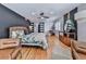 Cozy main bedroom featuring hardwood floors, stylish decor, and ample natural light at 120 Huntcliff Pt, Atlanta, GA 30350
