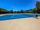 A well-maintained community tennis court awaits friendly competition and leisurely matches at 120 Huntcliff Pt, Atlanta, GA 30350