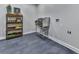 Utility room features stainless steel sink, practical shelving and grey flooring at 120 Huntcliff Pt, Atlanta, GA 30350