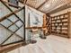 Unique wine cellar with custom wood shelving and vintage decor provides a charming entertaining space at 120 Huntcliff Pt, Atlanta, GA 30350