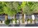 A home aerial showing tree coverage, the driveway and nearby neighborhood homes at 1379 Vintage Pointe Dr, Lawrenceville, GA 30044