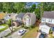An aerial view showcases a two-story home with beautiful landscaping, and a two-car garage at 1379 Vintage Pointe Dr, Lawrenceville, GA 30044