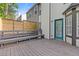 A gray stained wood deck with railings and stairs sits outside the back of this home at 1379 Vintage Pointe Dr, Lawrenceville, GA 30044