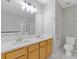 Bright bathroom features a double sink vanity, large mirror, and modern fixtures at 1379 Vintage Pointe Dr, Lawrenceville, GA 30044