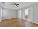 Large bedroom with hardwood floors and an ensuite bathroom and walk-in closet at 1379 Vintage Pointe Dr, Lawrenceville, GA 30044
