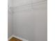 Walk-in closet with installed storage and hardwood floors at 1379 Vintage Pointe Dr, Lawrenceville, GA 30044