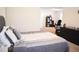 Bedroom featuring neutral colors, plus a desk and shelving unit, offering a flexible space at 3851 Bogan Mill Rd, Buford, GA 30519