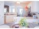 Bright eat-in kitchen with white cabinets, stainless steel appliances, and open layout at 3851 Bogan Mill Rd, Buford, GA 30519