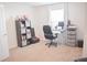 This room includes a desk, comfortable black chair, and ample storage shelves for a clutter-free workspace at 3851 Bogan Mill Rd, Buford, GA 30519