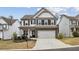 Charming two-story home featuring a two-car garage, landscaped yard, and a welcoming entrance at 531 S Fortune Way, Dallas, GA 30157