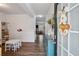 Bright foyer with wood floors, a view into connected rooms, and a decorative furniture piece at 531 S Fortune Way, Dallas, GA 30157