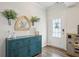 Foyer view with hardwood floors, decorative wall art, and a glimpse of a play area at 531 S Fortune Way, Dallas, GA 30157
