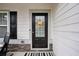 Close-up of a welcoming front door with decorative accents and a sidelight window at 531 S Fortune Way, Dallas, GA 30157