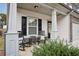 Inviting front porch featuring rocking chairs and a small table, perfect for relaxing outdoors at 531 S Fortune Way, Dallas, GA 30157