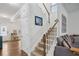 Hallway view leading to an open floor plan, with a staircase and living area in sight at 531 S Fortune Way, Dallas, GA 30157