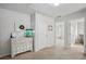 Bright hallway featuring a white dresser and access to additional rooms at 531 S Fortune Way, Dallas, GA 30157