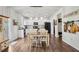 Charming eat-in kitchen with white cabinets, stainless appliances, and wood-look flooring at 531 S Fortune Way, Dallas, GA 30157