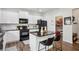 Modern kitchen featuring an island, white cabinets, stainless steel appliances and stone countertops at 531 S Fortune Way, Dallas, GA 30157