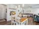 Open-concept living space with a staircase and a dining area with wood-look flooring at 531 S Fortune Way, Dallas, GA 30157