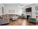 Cozy living room with a fireplace, hardwood floors, and comfortable seating arrangement at 531 S Fortune Way, Dallas, GA 30157