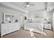 Spacious main bedroom with a tray ceiling, bright windows, and neutral decor at 531 S Fortune Way, Dallas, GA 30157